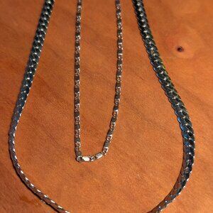 18" Cuban link stainless paired with a 14" sterling chain to make one.